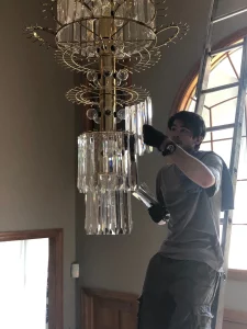 Cleaning a chandelier