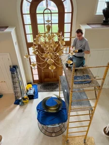 Chandelier Cleaning on scaffold